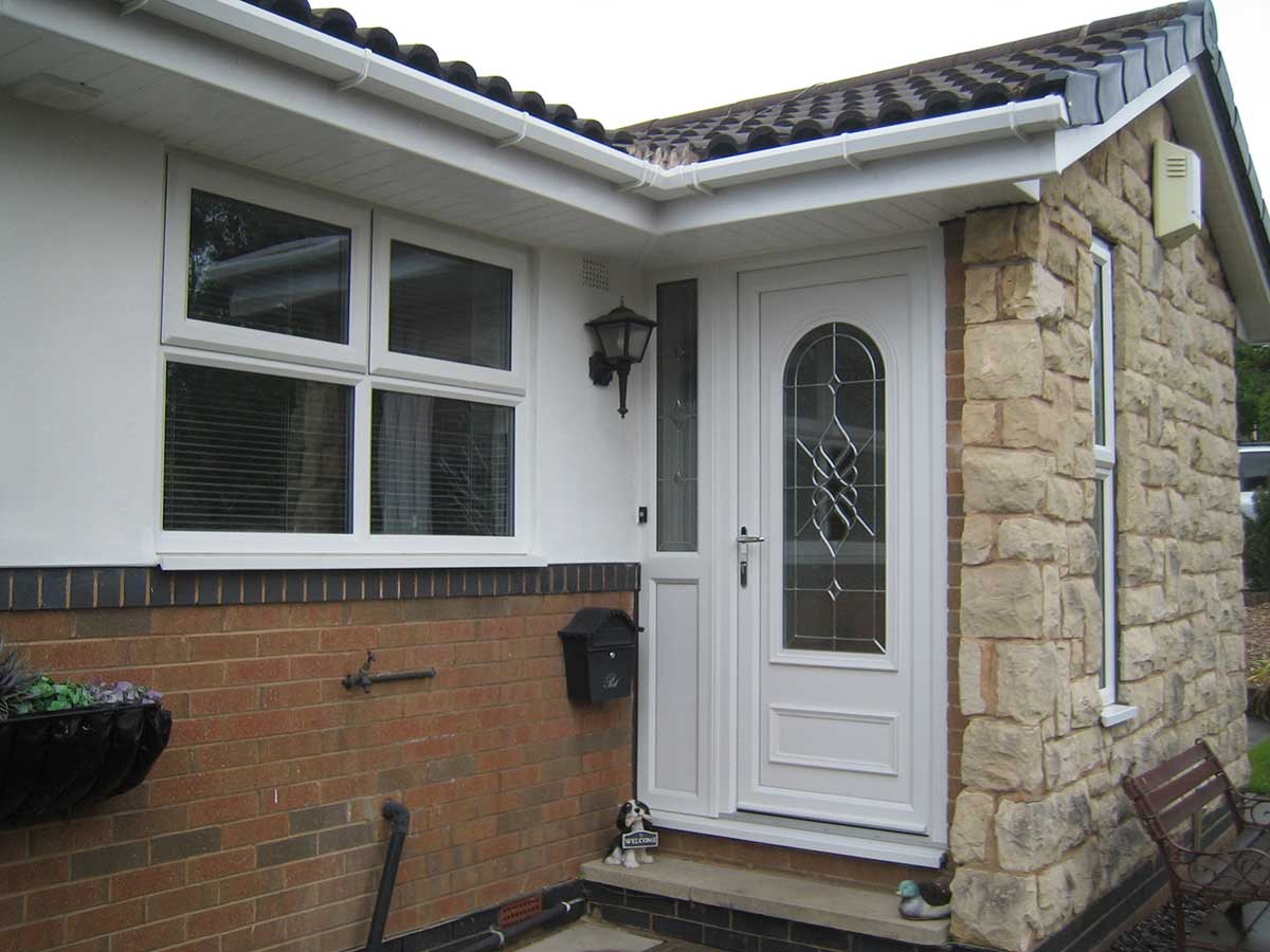 UPVC front door and matching UPVC windows, providing a sleek, modern appearance with enhanced security and energy efficiency.