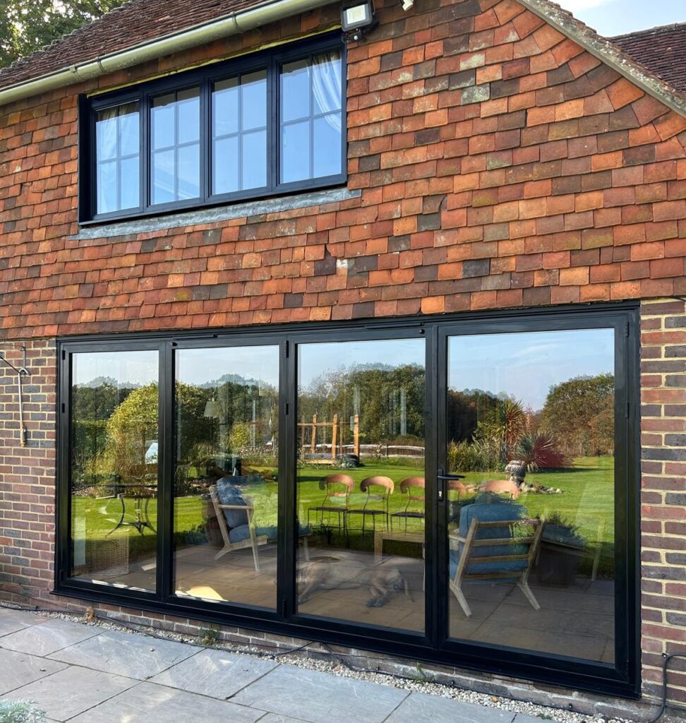 black bi fold doors new installed with aluminium windows and bi-folding doors