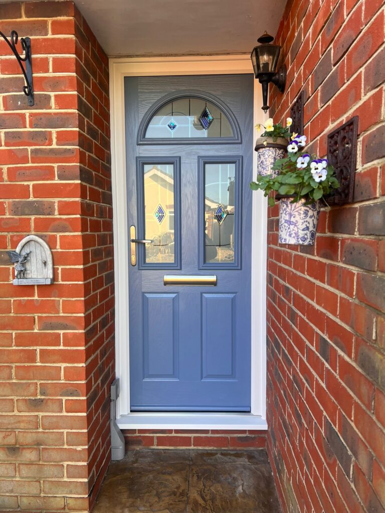 blue new composite door installed with a lovely new entryway