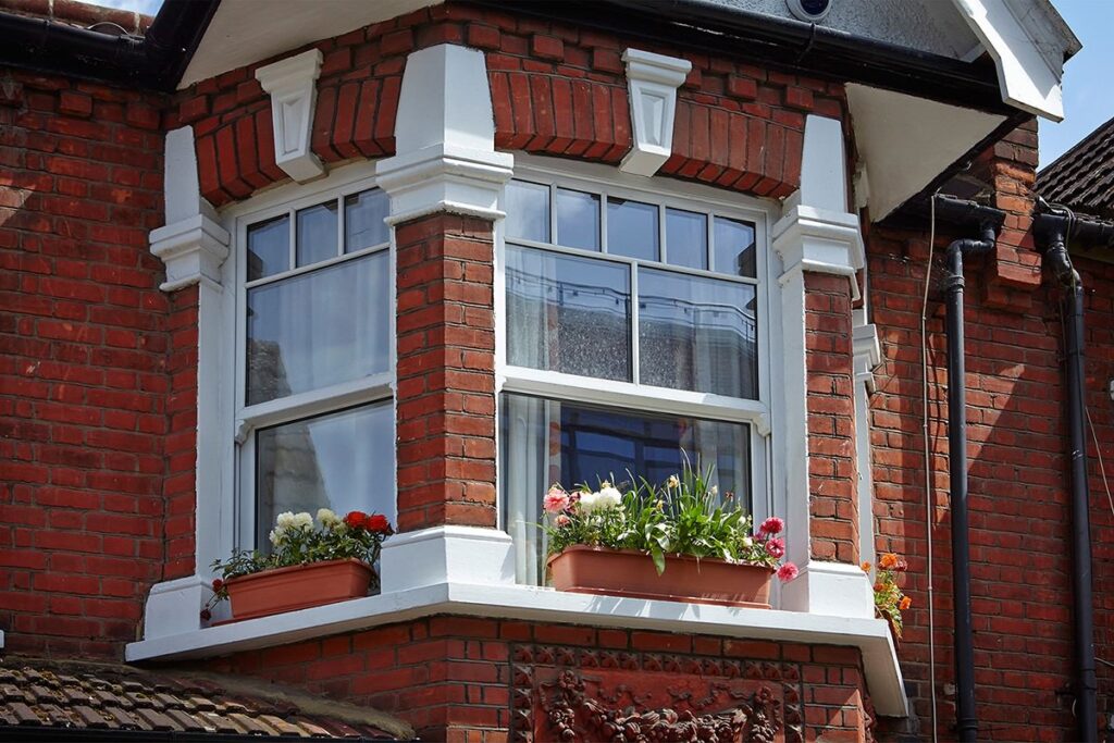 double glazed upvc sliding sash in a bay window