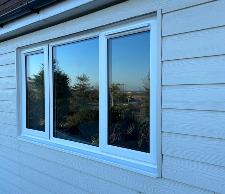 new exterior cladding with a new upvc windows installed in eastbourne
