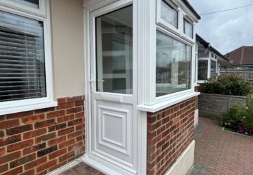 upvc door in new installed porch with upvc windows
