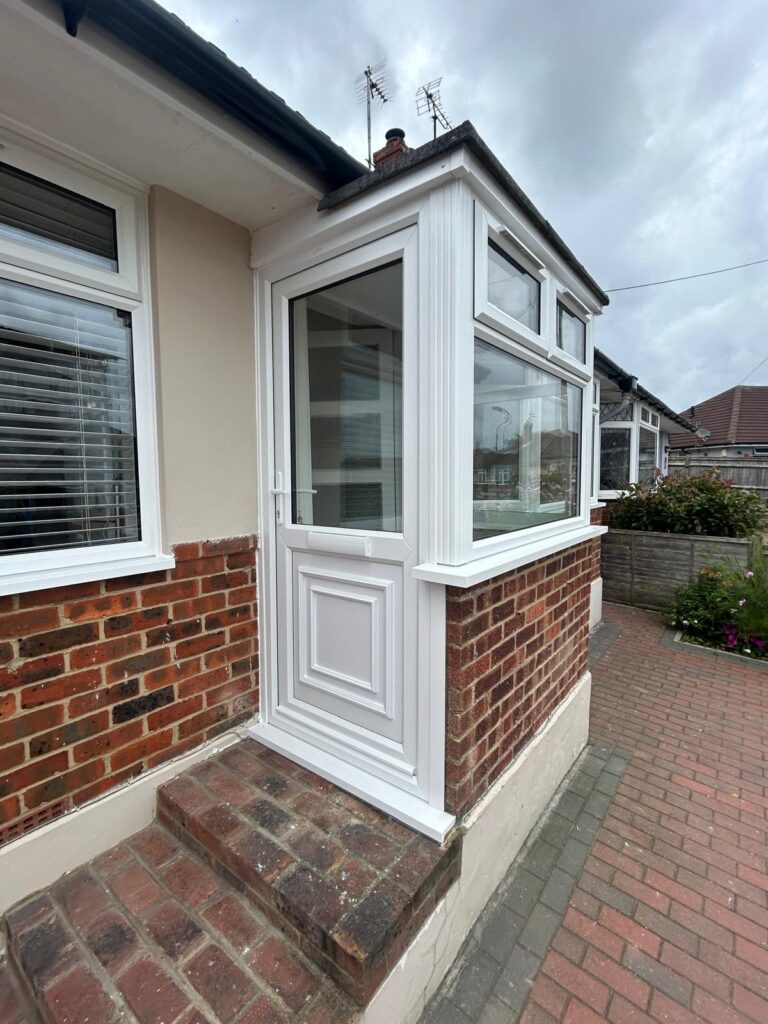 upvc door in new installed porch with upvc windows