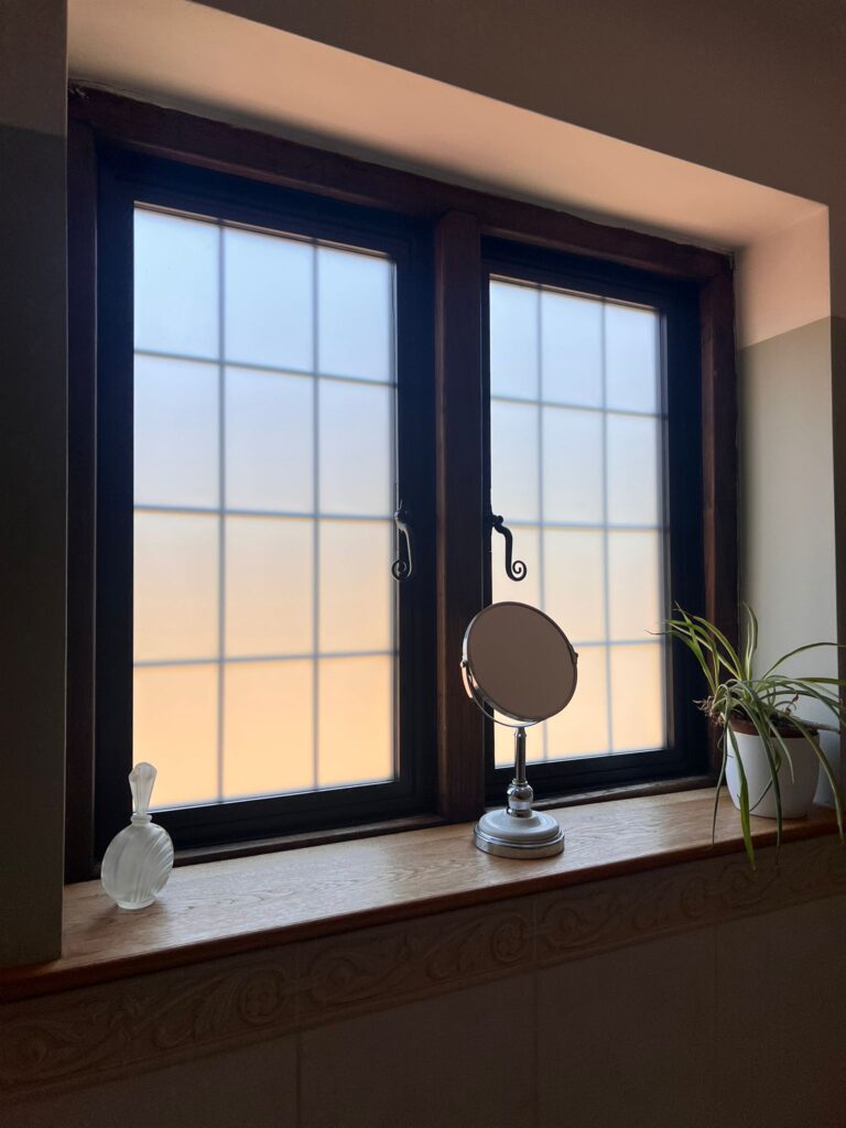 Interior view of black aluminium windows installed in Crowborough home, showcasing a modern and sleek finish.