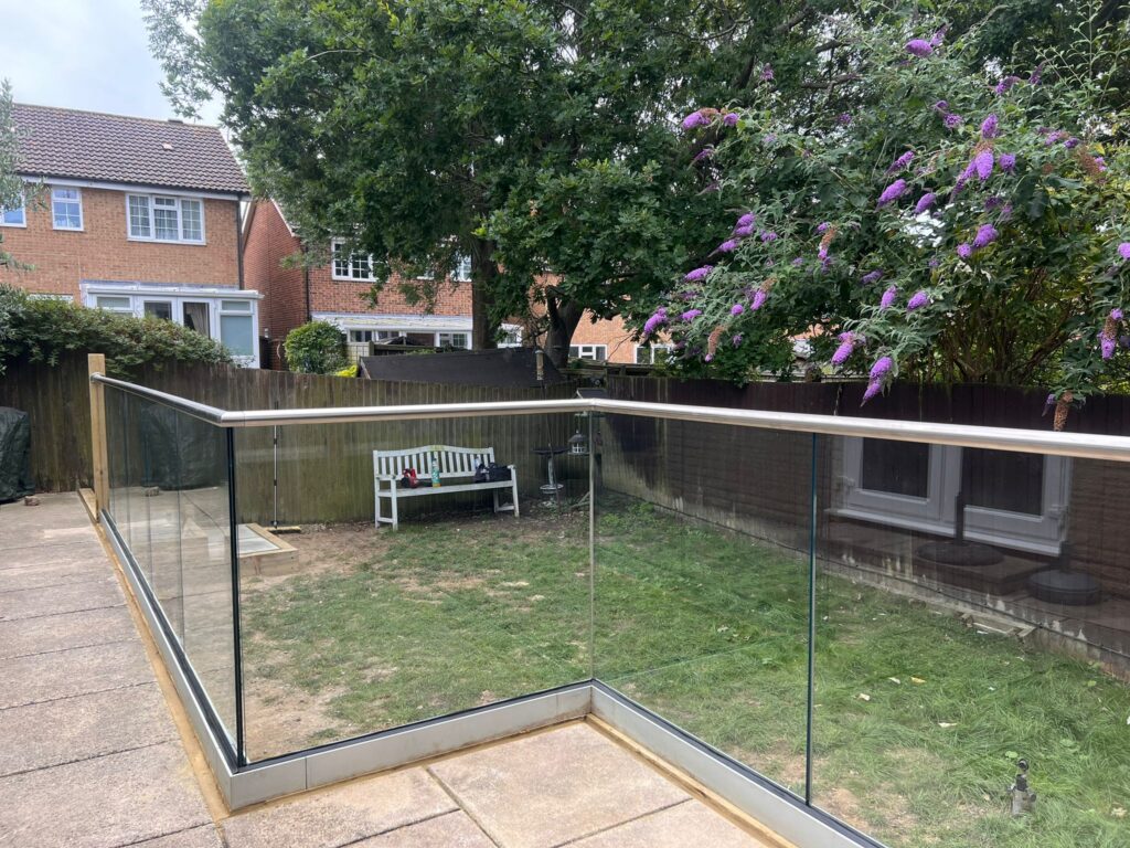 new Glass Balustrade with top rail installed previously no top rail
