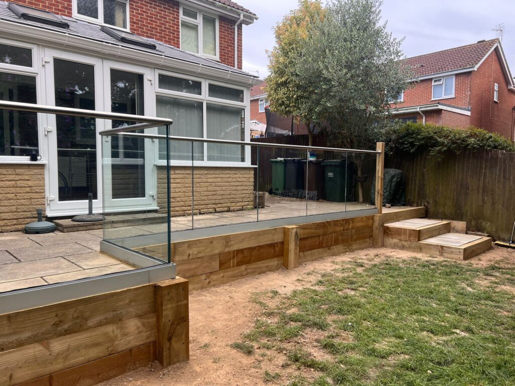 new wooden sleepers installed with Glass Balustrade and new top rail
