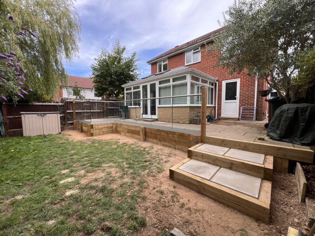 new Glass Balustrade installed with the new wooden sleepers to help with sinking and tliting