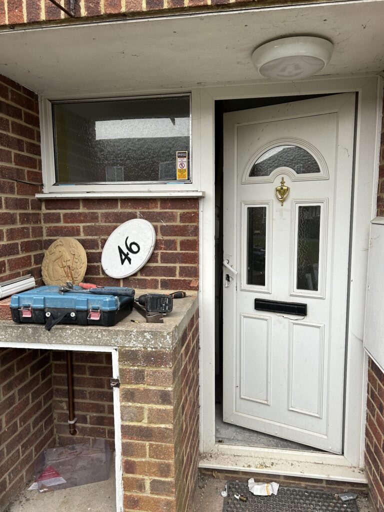 old upvc door before new composite door front