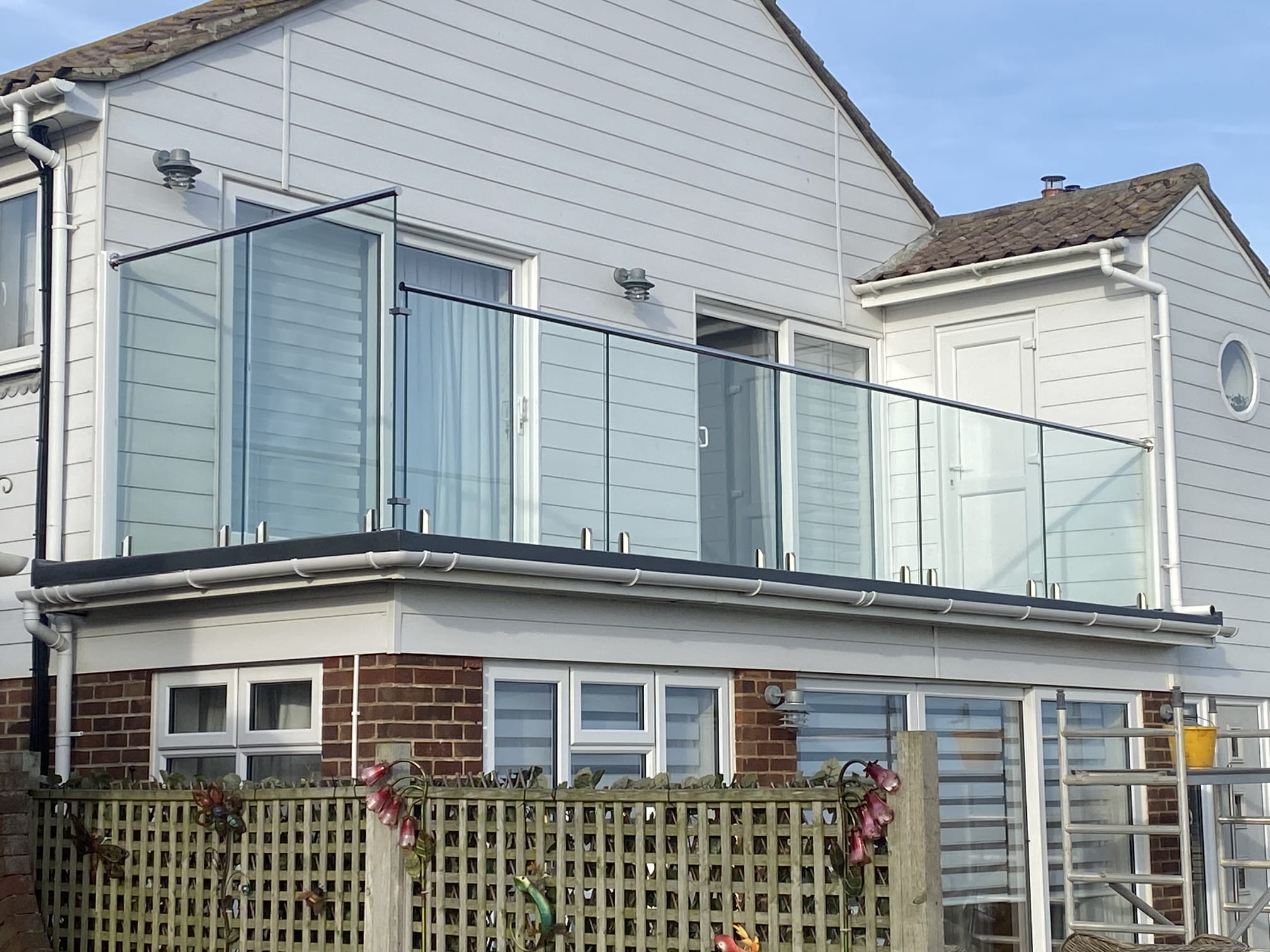 new glass Balustrade balcony installed onto flat roof
