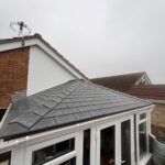 Completed flat warm roof conservatory installation with tiled finish using existing base