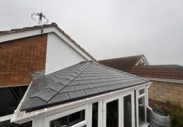 Completed flat warm roof conservatory installation with tiled finish using existing base