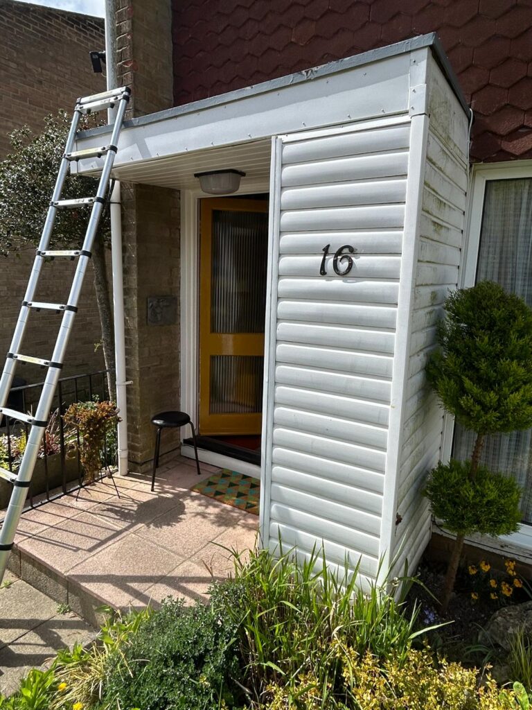 before image of old upvc cladding on a porch