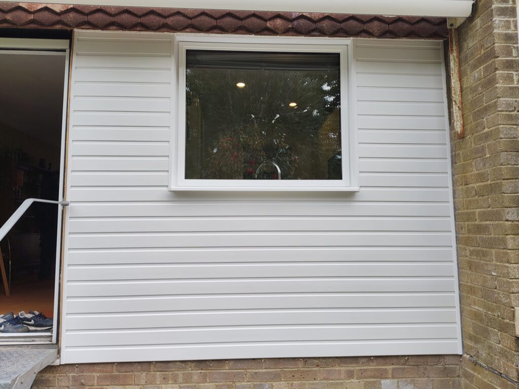 back of house with new upvc cladding installed in heathfield