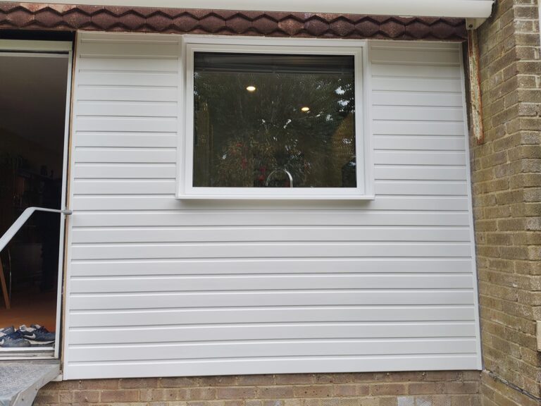 back of house with new upvc cladding installed in heathfield